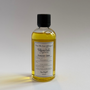 Bottle of 'Summer Daze' fragrance oil with a black cap on a light gray background